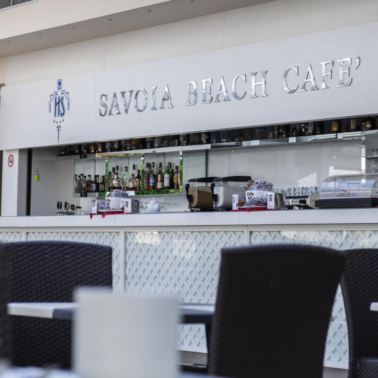 Beach café with a large bar and outdoor seating.